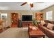 Living room with built-in shelving and large TV at 5099 Ballantine Dr, Summerville, SC 29485