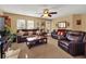 Relaxing living room with leather furniture and large TV at 5099 Ballantine Dr, Summerville, SC 29485