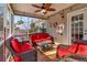 Cozy screened porch with wicker furniture and a ceiling fan at 5099 Ballantine Dr, Summerville, SC 29485