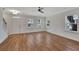 Spacious living room with hardwood floors and abundant natural light at 5294 Seewee Rd, Awendaw, SC 29429