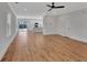 Open concept living room and kitchen with hardwood floors at 5294 Seewee Rd, Awendaw, SC 29429