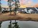 Stunning aerial view of home and lake at 559 Tidewater Chase Ln, Summerville, SC 29486