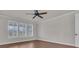 Bright bedroom with wood floors and plantation shutters at 559 Tidewater Chase Ln, Summerville, SC 29486