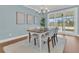 Cozy dining space with a wooden table, chairs, and view of the backyard at 559 Tidewater Chase Ln, Summerville, SC 29486