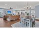 Bright dining area with a farmhouse table and chairs, located near the kitchen at 559 Tidewater Chase Ln, Summerville, SC 29486