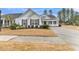 Two-story house with gray siding, white trim, and a two-car garage at 559 Tidewater Chase Ln, Summerville, SC 29486