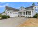 Two-story house with gray siding, white trim, and a two-car garage at 559 Tidewater Chase Ln, Summerville, SC 29486