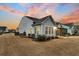 Well-maintained home exterior at sunset at 559 Tidewater Chase Ln, Summerville, SC 29486