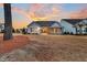 House exterior with backyard and sunset view at 559 Tidewater Chase Ln, Summerville, SC 29486