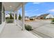 Inviting front porch with white columns, overlooking a quiet street at 559 Tidewater Chase Ln, Summerville, SC 29486