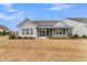 Gray house with screened porch and nicely landscaped yard at 559 Tidewater Chase Ln, Summerville, SC 29486
