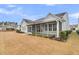 Gray house with screened porch, surrounded by a landscaped yard at 559 Tidewater Chase Ln, Summerville, SC 29486