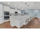 Modern kitchen with white cabinets, large island, and stainless steel appliances at 559 Tidewater Chase Ln, Summerville, SC 29486