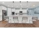 Modern kitchen with white cabinets, large island, and stainless steel appliances at 559 Tidewater Chase Ln, Summerville, SC 29486