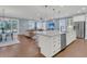 Open concept kitchen features a large island, stainless steel appliances, and white cabinetry at 559 Tidewater Chase Ln, Summerville, SC 29486