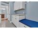 Laundry room with white cabinets, bench, and washer/dryer at 559 Tidewater Chase Ln, Summerville, SC 29486