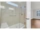 Walk-in shower with glass enclosure and built-in seat at 559 Tidewater Chase Ln, Summerville, SC 29486