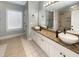 Double vanity bathroom with granite countertops and walk-in shower at 7228 Mossy Creek Ln, Hanahan, SC 29410