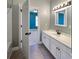 Bathroom with white vanity, tile floor, and an open doorway at 7228 Mossy Creek Ln, Hanahan, SC 29410