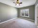Bedroom with green walls, carpet, and a large window at 7228 Mossy Creek Ln, Hanahan, SC 29410