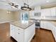 Eat-in kitchen with white cabinets, granite island, and stainless steel appliances at 7228 Mossy Creek Ln, Hanahan, SC 29410