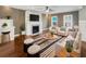 Spacious living room with hardwood floors, fireplace, and comfy seating at 7228 Mossy Creek Ln, Hanahan, SC 29410