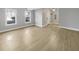 Bright living room with hardwood floors and neutral walls at 7228 Mossy Creek Ln, Hanahan, SC 29410