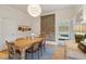 Elegant dining room featuring a wooden table, unique wall tapestry, and hardwood floors at 784 Natchez Cir, Mount Pleasant, SC 29464