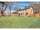 Brick house with fenced backyard, firepit, and spacious lawn at 1 Hunters Forest Dr, Charleston, SC 29414