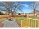 Landscaped backyard with firepit and wood deck at 1 Hunters Forest Dr, Charleston, SC 29414