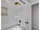 Clean bathroom with white subway tile, gold fixtures, and a bathtub at 1 Hunters Forest Dr, Charleston, SC 29414