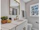 Modern bathroom with white vanity, gold fixtures, and quartz countertop at 1 Hunters Forest Dr, Charleston, SC 29414