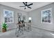 Spacious bedroom with gray carpet, large windows, and a modern desk at 1 Hunters Forest Dr, Charleston, SC 29414