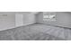 Bright bedroom with gray carpet and large window at 1 Hunters Forest Dr, Charleston, SC 29414