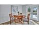 Charming dining area with wooden table and chairs, near French doors at 1 Hunters Forest Dr, Charleston, SC 29414