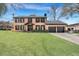 Brick house with a two-car garage and manicured lawn at 1 Hunters Forest Dr, Charleston, SC 29414