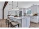 Modern kitchen with white cabinets, a large island, and quartz countertops at 1 Hunters Forest Dr, Charleston, SC 29414