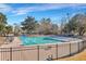 Community lap pool with surrounding patio and fence at 1 Hunters Forest Dr, Charleston, SC 29414