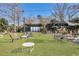 Community outdoor patio with tables, chairs, and stage at 1 Hunters Forest Dr, Charleston, SC 29414