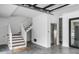 Finished basement with a staircase, elevator, and garage access at 100 Murray Blvd, Charleston, SC 29401