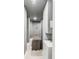 Serene basement spa with massage table and modern cabinetry at 100 Murray Blvd, Charleston, SC 29401