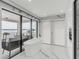 Spa-like bathroom with marble floors, a free-standing tub, and access to a balcony with a water view at 100 Murray Blvd, Charleston, SC 29401