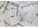 Modern bathroom with marble walls, a glass shower, and floating vanity at 100 Murray Blvd, Charleston, SC 29401