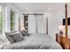 Main bedroom with a comfortable four-poster bed and plenty of natural light at 100 Murray Blvd, Charleston, SC 29401