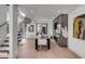 Elegant dining room with hardwood floors and modern staircase at 100 Murray Blvd, Charleston, SC 29401