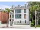 Three-story home with large windows and a modern design at 100 Murray Blvd, Charleston, SC 29401