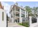 Modern three-story home with a gated entrance at 100 Murray Blvd, Charleston, SC 29401