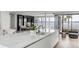Modern kitchen with marble island, water views, and high-end appliances at 100 Murray Blvd, Charleston, SC 29401