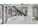 Spacious living area with modern staircase and dining area at 100 Murray Blvd, Charleston, SC 29401