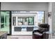 Open living space with sliding glass doors revealing pool and view at 100 Murray Blvd, Charleston, SC 29401